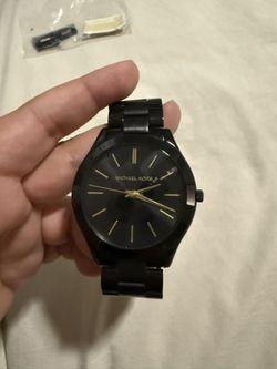 Woman’s Black Michael Kors Watch