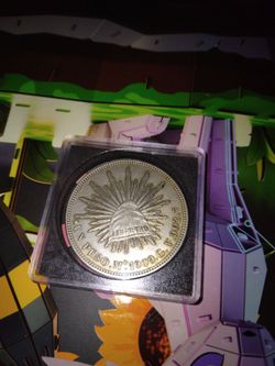 UN PESO MEXICO 1909 SILVER COIN