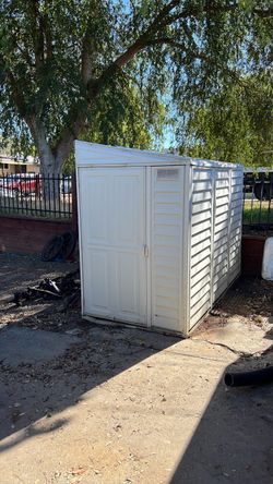 Metal shed with angled roof