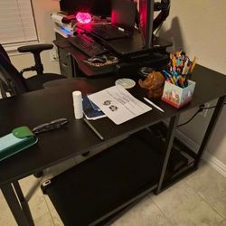 Black L shaped desk and chair