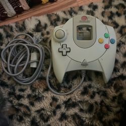 This is an official Sega Dreamcast controller in white