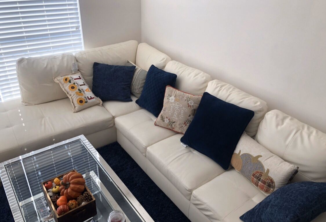 Very firm Sectional, shaggy navy blue rug, and silver table for SALE!