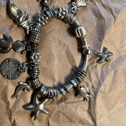 Bracelet Sterling Silver .925 with extra charms origin unknown 