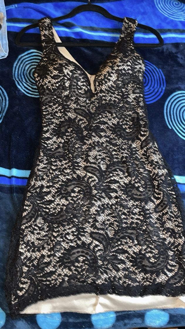 Dazzle with this black strap dress,