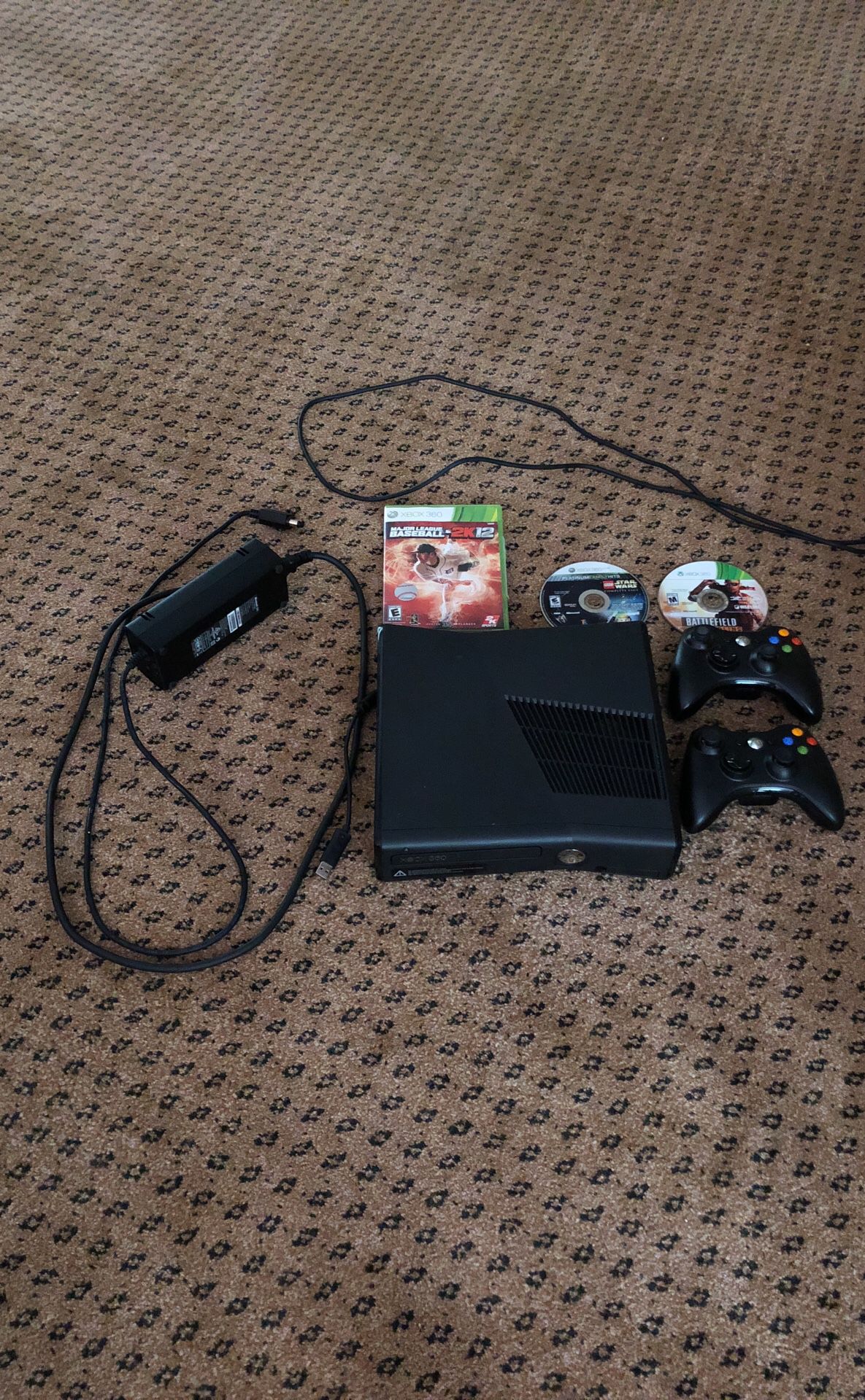 Xbox 360 with multiple games and controllers