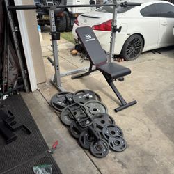 Bench press/squat rack with 7ft 40lbs bar plus 240lbs of Olympic weights and tricep bar