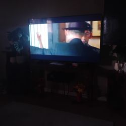 Like New 65" Tv And Stand. 