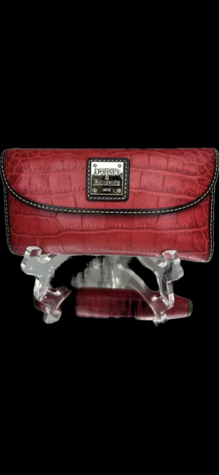 Dooney & Bourke Continental Clutch wallet in embossed leather finish. Redddish color