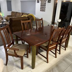 Large wood dining table with chairs
