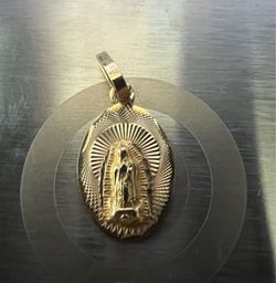Virgin mary gold pendent