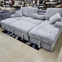 New Sectional With Pullout Bed, Cupholders And Storage
$1099