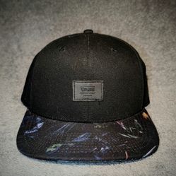 Black Vans cap with floral pattern on the visor