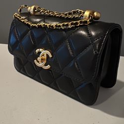 Chanel Elegant Quilted Mini Purse - Black with Gold Chain Accent
