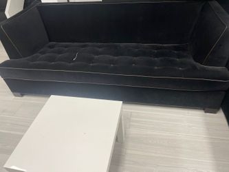 Black velvet performance fabric with brown leather buttons and brown leather piping