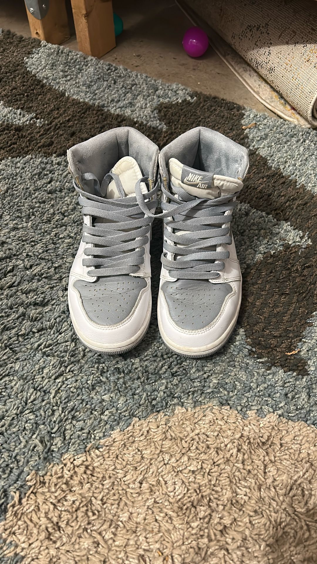 Jordan 1 High in a Wolf Grey / Neutral Grey–style colorway.