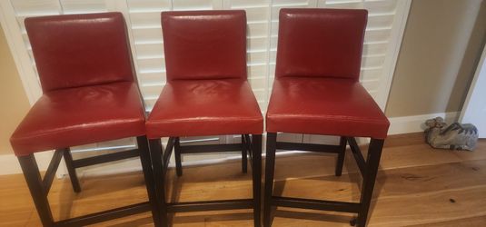 Three kitchen counter chairs