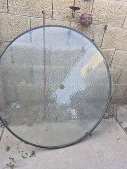 Outdoor glass umbrella table, 48x48 in size.
