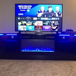  Dark Cherry Oakwood FirePlace Tv Stand with LED Lights. Fits all sizes. Heats and cools (60*F - 99*F.)