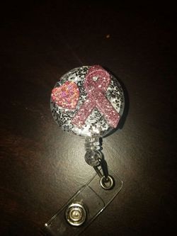 Retractable bagde holder