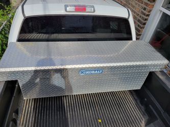 Crossover truck tool box