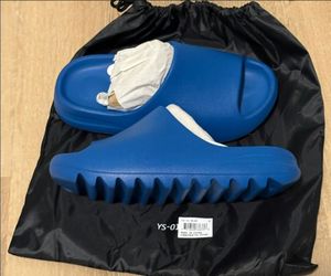 Yeezy Slides Blue  Brand New in YS 01 Bag 100% authentic size 12 pick up in Northridge area $65