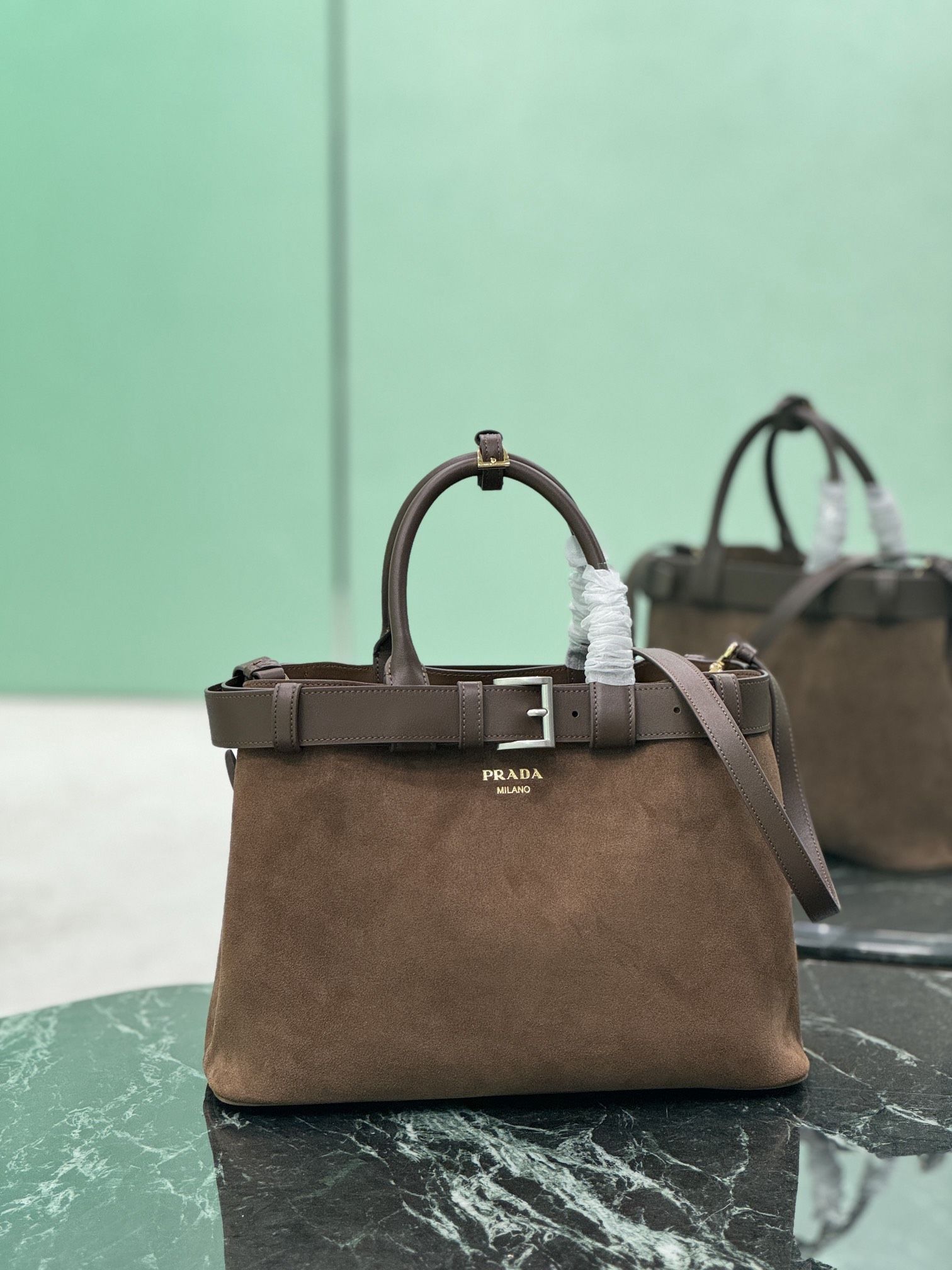 𝐏𝐫𝐚𝐝𝐚 suede strap handbag (medium size)