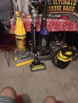 Dyson's Vacuum Upright Vacuum Cleaner And A Stanley Tub Cleaner
