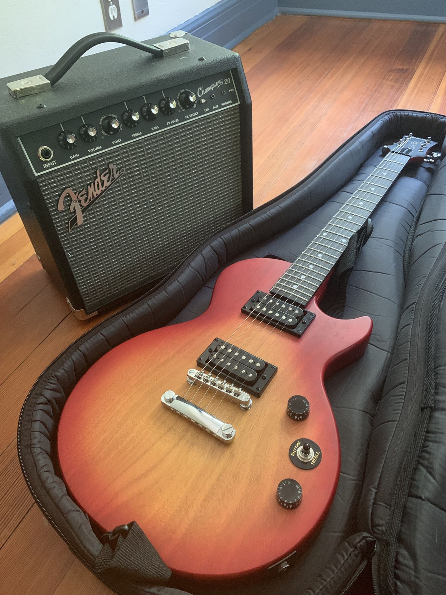 Les Paul electric guitar bundle. Comes with amp and cords.