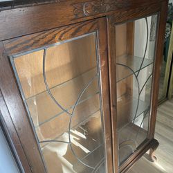 Vintage locking bookcase with double leaded glass doors and glass side panels, working interior light, two marble glass shelves