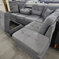 Brand New Gray Linen Reversible Sectional With Cup Holders + Storage Ottoman