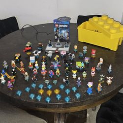 Lego Dimensions for PS4.  Includes 60 Characters/19 Mystery Character Disks/ The Game CD and Extra Pieces To Build The Wormhole And More $260 OBO