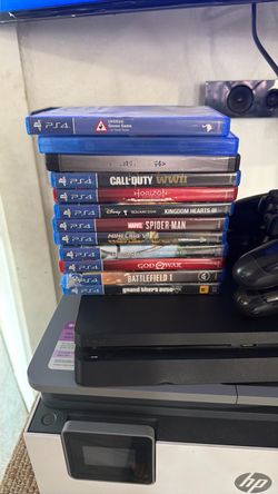 PS4 two remotes and 12 games