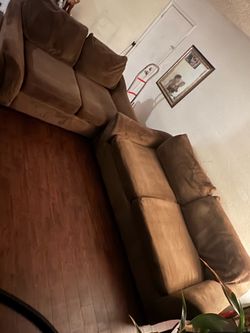Brown sofa and loveseat set