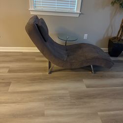 Chaise lounge chair with an attached table