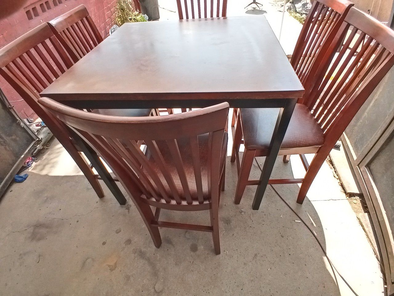 BEAUTIFUL TALL WOOD TABLE WITH METAL LEGS AND 6 HEAVY TALL WOOD CHAIRS NEW SEATING, IN EXCELLENT CONDITION $170 NEGOTIABLE