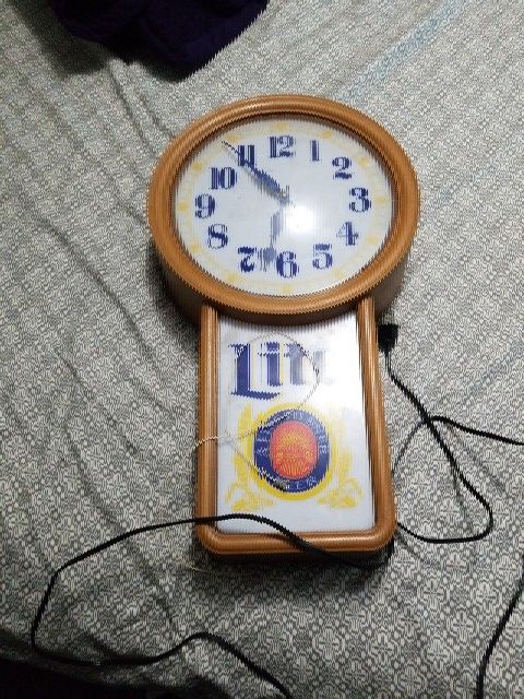 Vintage Miller lite light clock from 1988 still lights up as seen on photo
