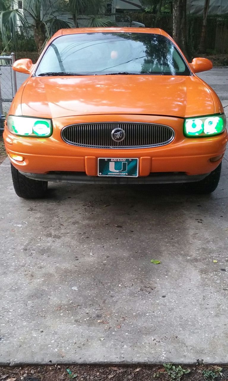 2002 Buick LeSabre on 26 inch Dub rims with green light kits for a wheel well and green light kit for the headlights