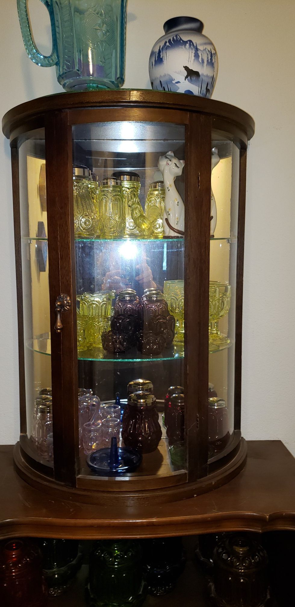 Semi round antique display cabinet