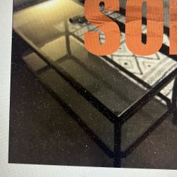 Glass And Black Framed Coffee Table $40