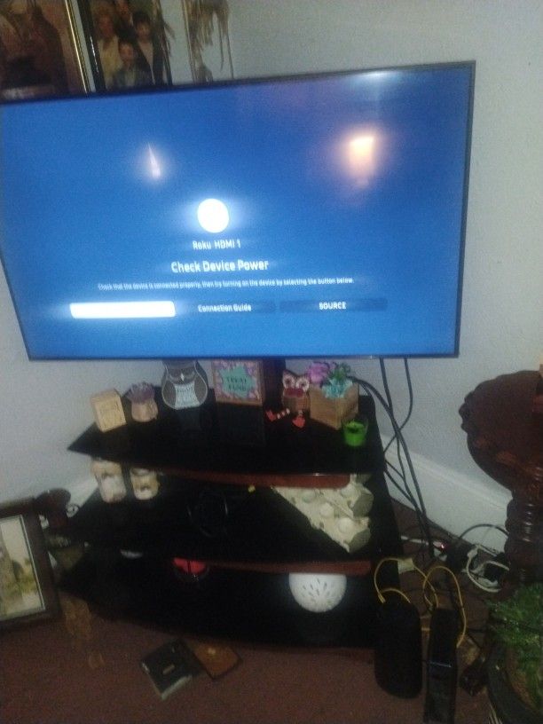 50" Samsung UN50TU7000F Smart TV With Mounted Entertainment Center And Roku Entertainment 225$