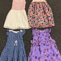 Bundle of 4 super cute gently used toddler girls size 24 month and 2T summer dresses 