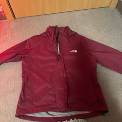 Small burgundy North Face rain coat