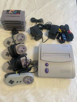 Original Super Nintendo w/ 5 games + 4 controllers