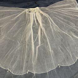 Bridal Veil and Tiara with Crystals and Pearls from David Bridal . Vail is 32” long