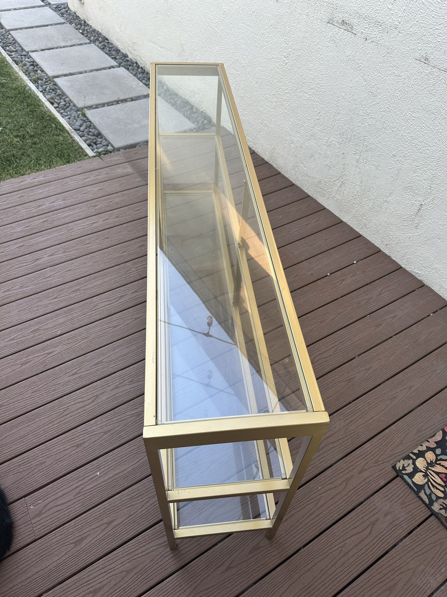 Gold And Glass Shelving 