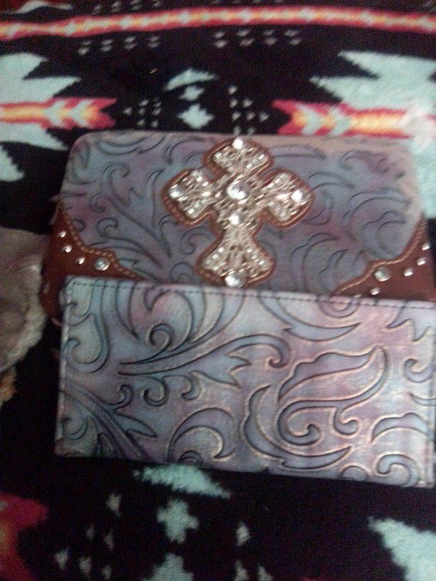 A Wallet With The Cross On It