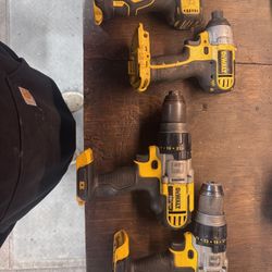 Two Dewalt Impact Guns And Two Dewalt Drills