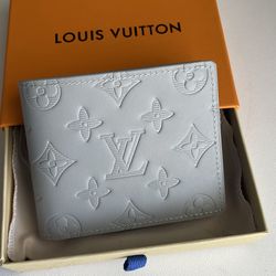 Gray Louis Vuitton wallet * NEGOTIABLE*