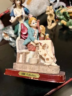 Sculpture Figurine (Boy Feeding Pup)