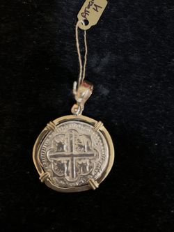 Atocha silver coin in gold bezel